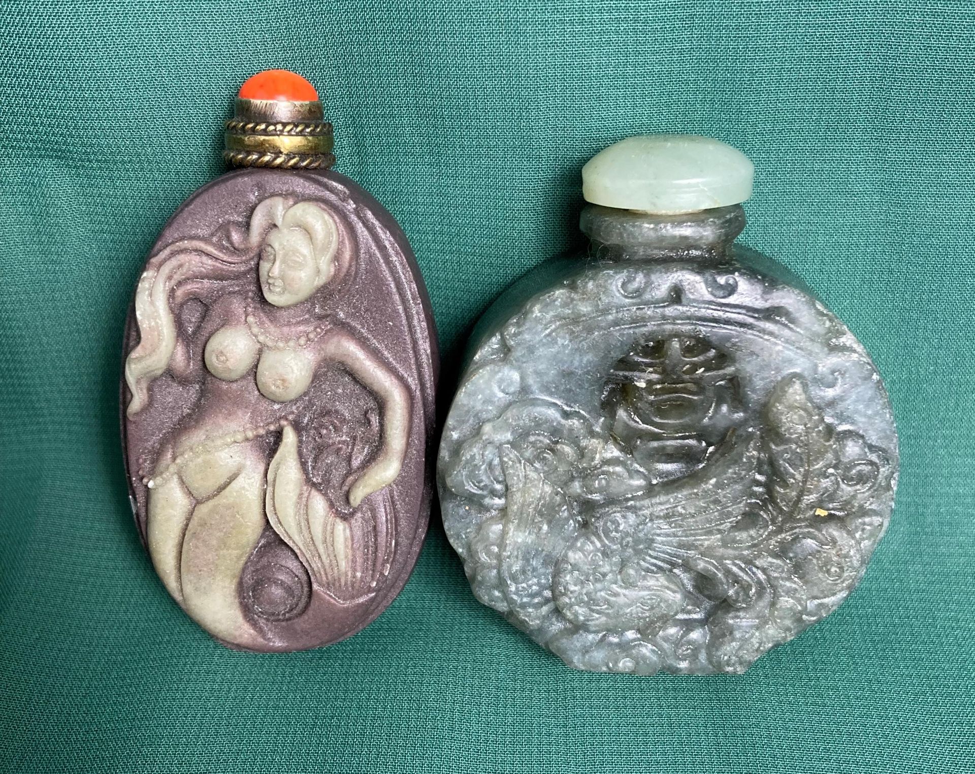 Two assorted jade/jadeite carved snuff bottle stoppers (only one spoon), 5.5cm and 6.