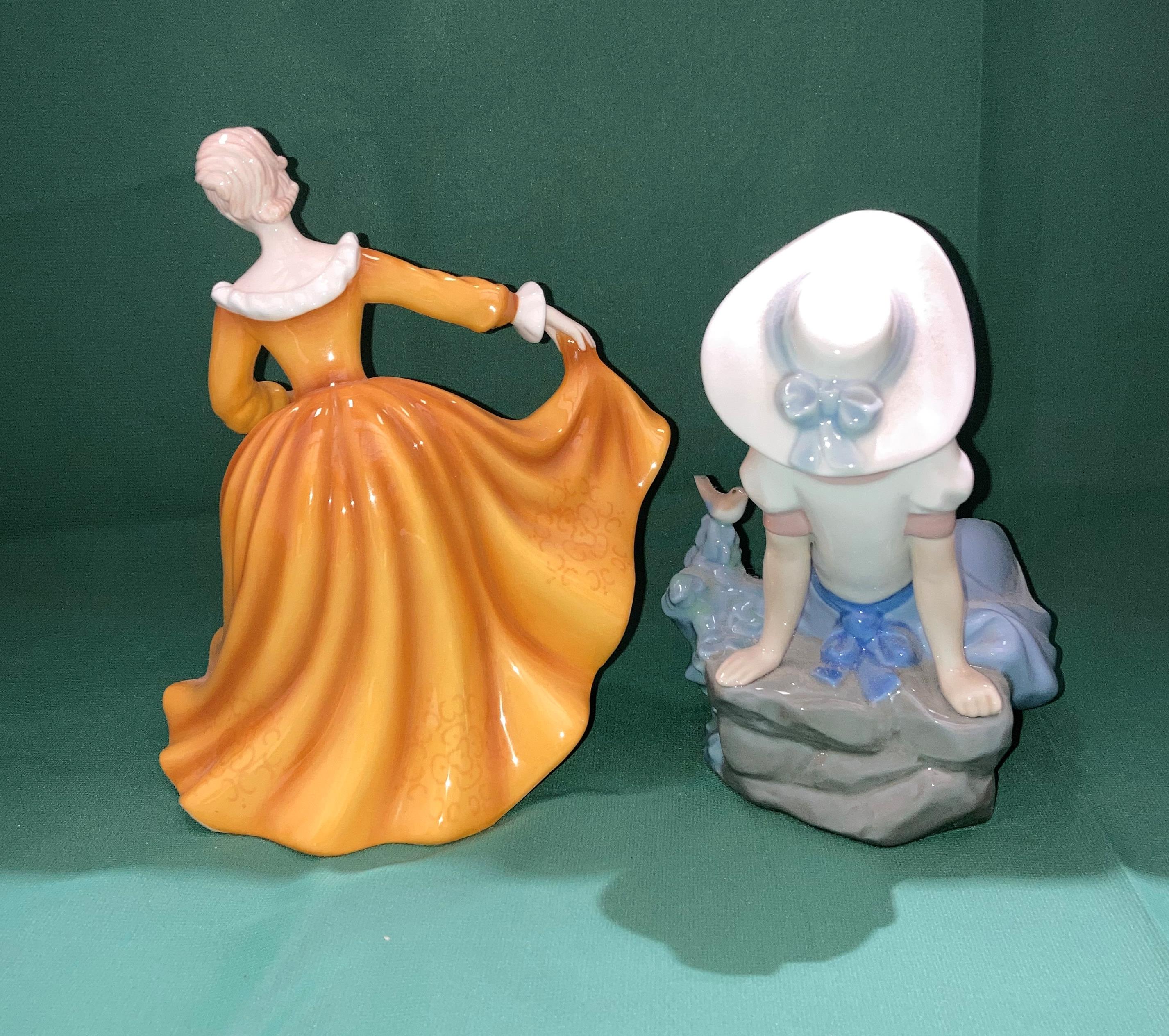 A Royal Doulton Pretty Ladies Best of the Classics 'Kirsty' ceramic figurine and a Nao Yong girl - Image 2 of 4