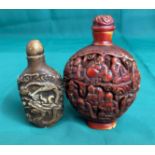 Two assorted Oriental snuff bottles including a brown bottle with stopper decorated with dragons