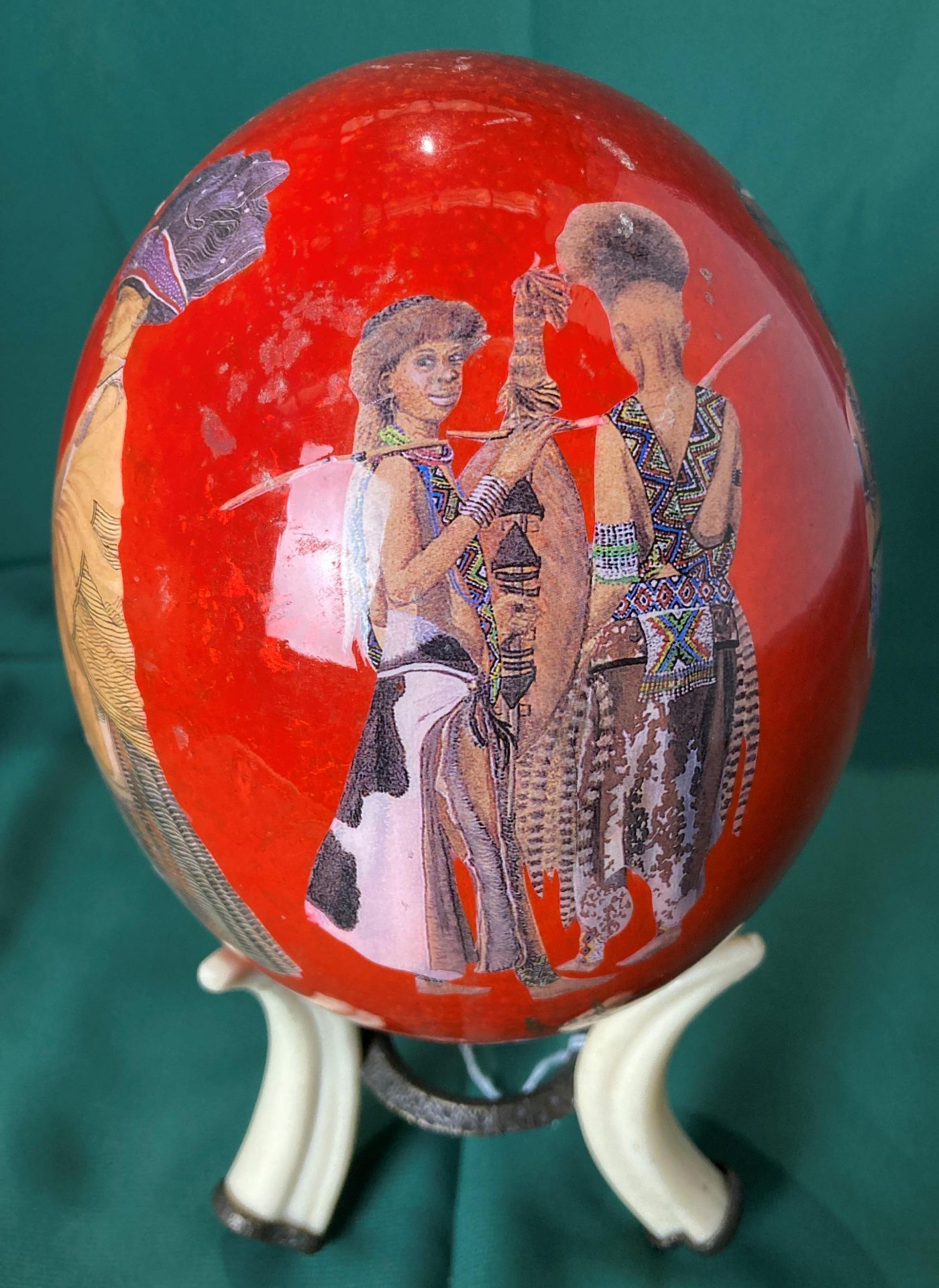 Hand-painted ostrich egg with African design on a reproduction tusk stand, - Image 2 of 5
