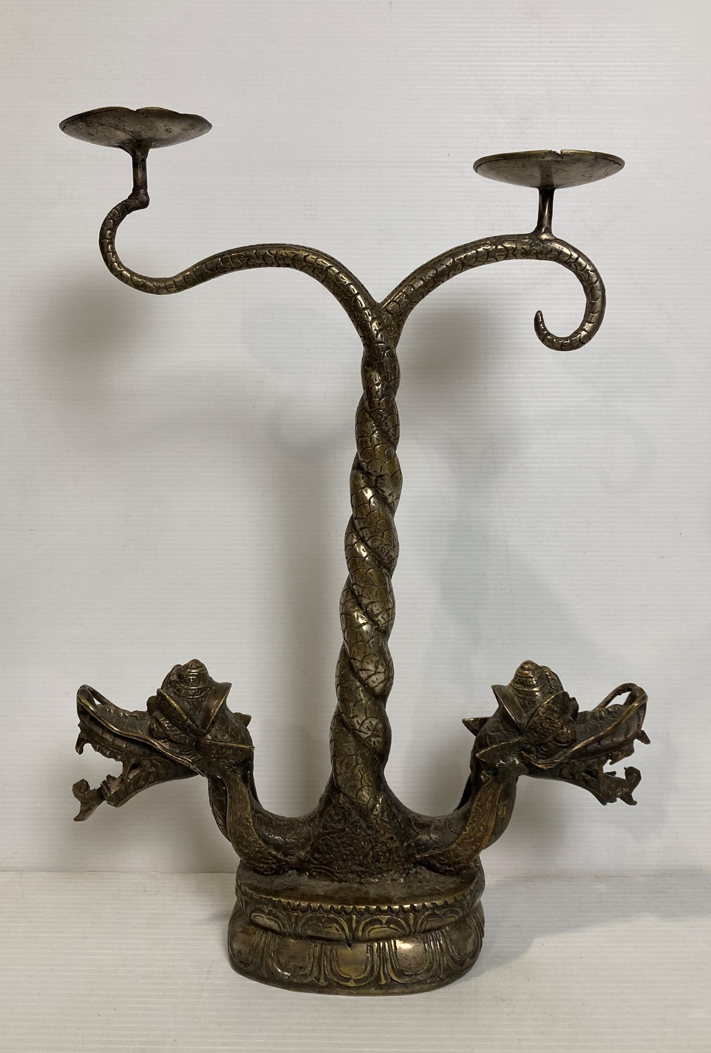 A vintage brass Oriental double dragon candelabra with twisted tail stamp in a Qing Dynasty style,