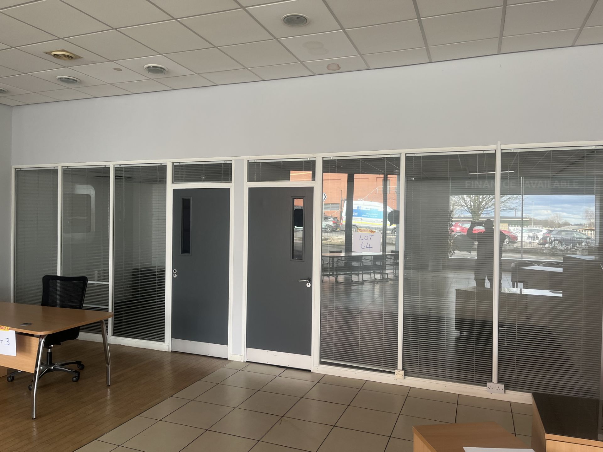 Glass partition section comprising six panels and two doors (Please note the successful bidder is