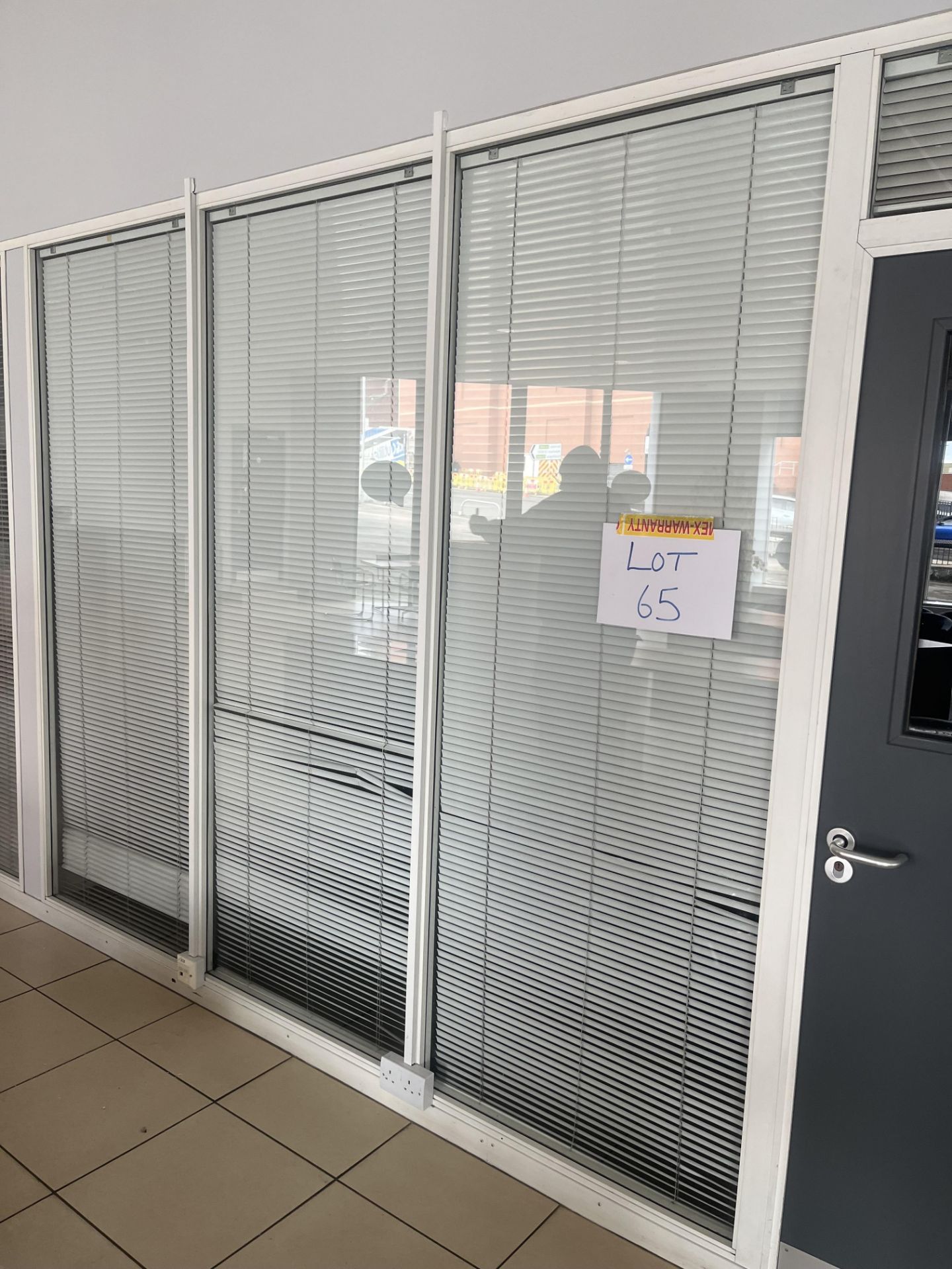 Glass partition section comprising three panels and one door (Please note the successful bidder is