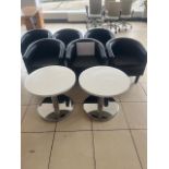 Two small tables and six tub chairs
