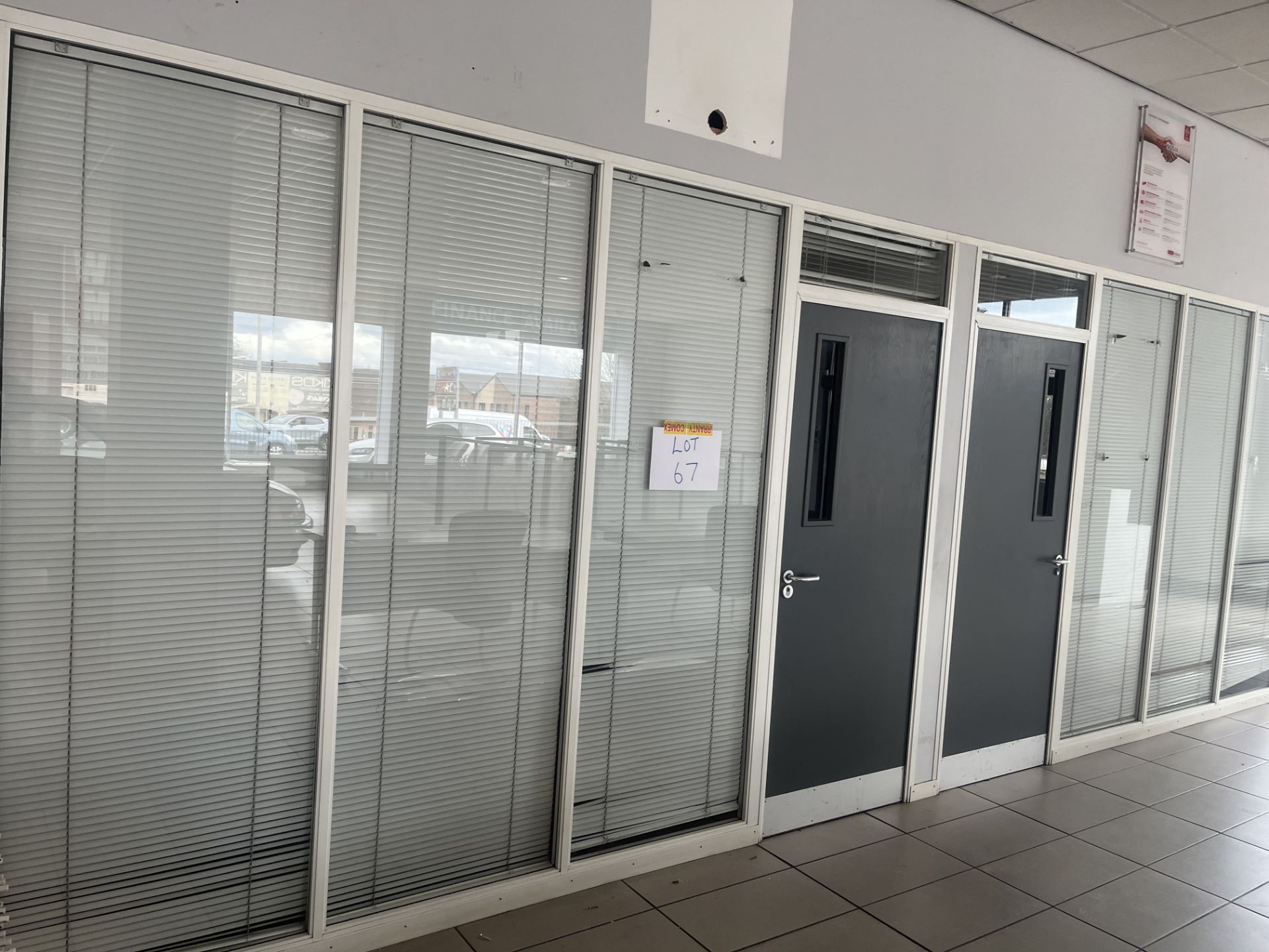 Glass partition section comprising six panels and two doors (Please note the successful bidder is