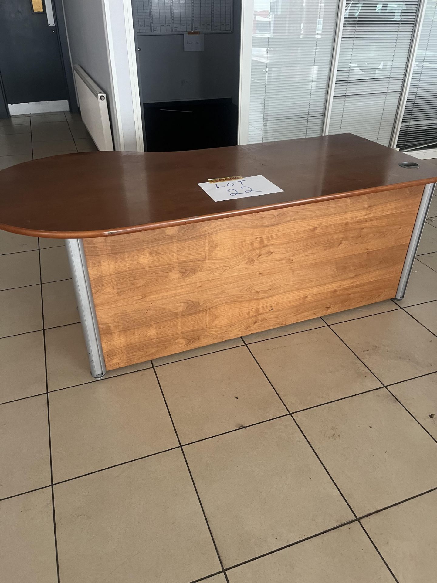 Shaped office desk in dark wood effect finish