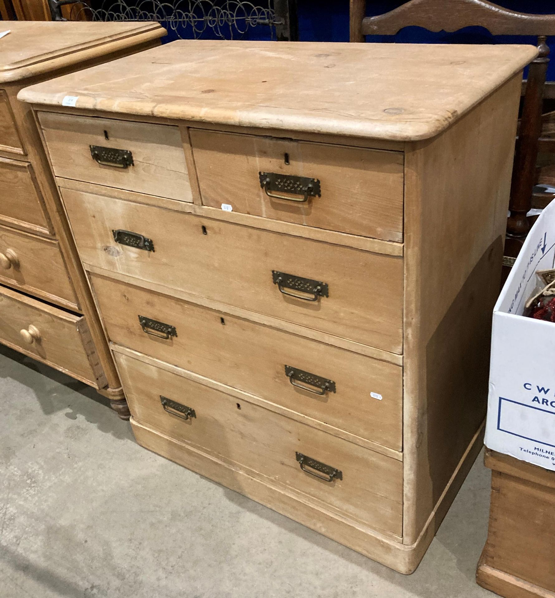 A pine five-drawer (two short, three long) chest of drawers,