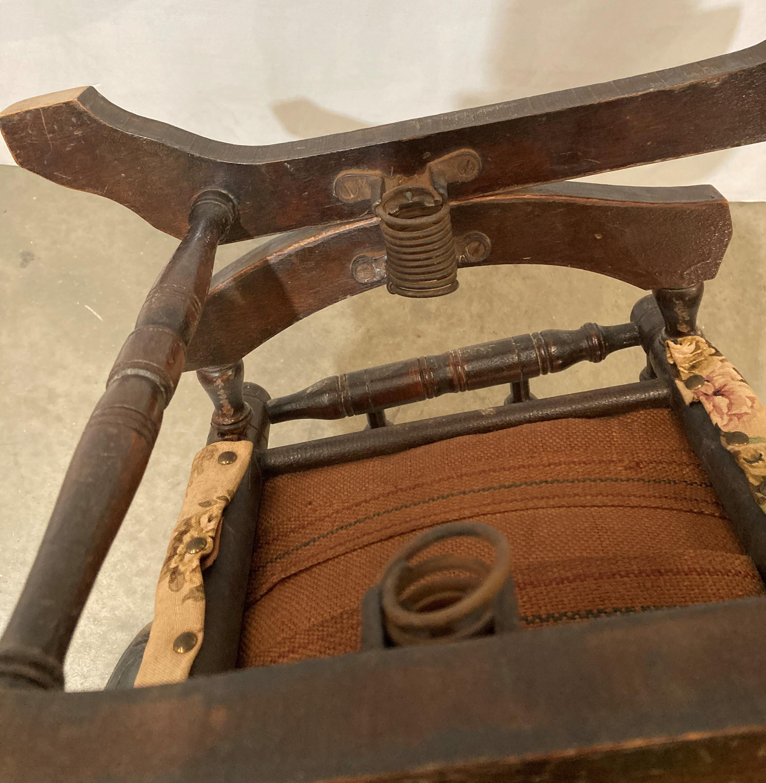 A vintage mahogany children's rocking chair with floral fabric and turned supports, - Image 4 of 4