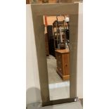 Wall hung mirror with clear glass background,