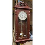 A Hermle wall clock in mahogany finish case,