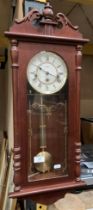 A Hermle wall clock in mahogany finish case,