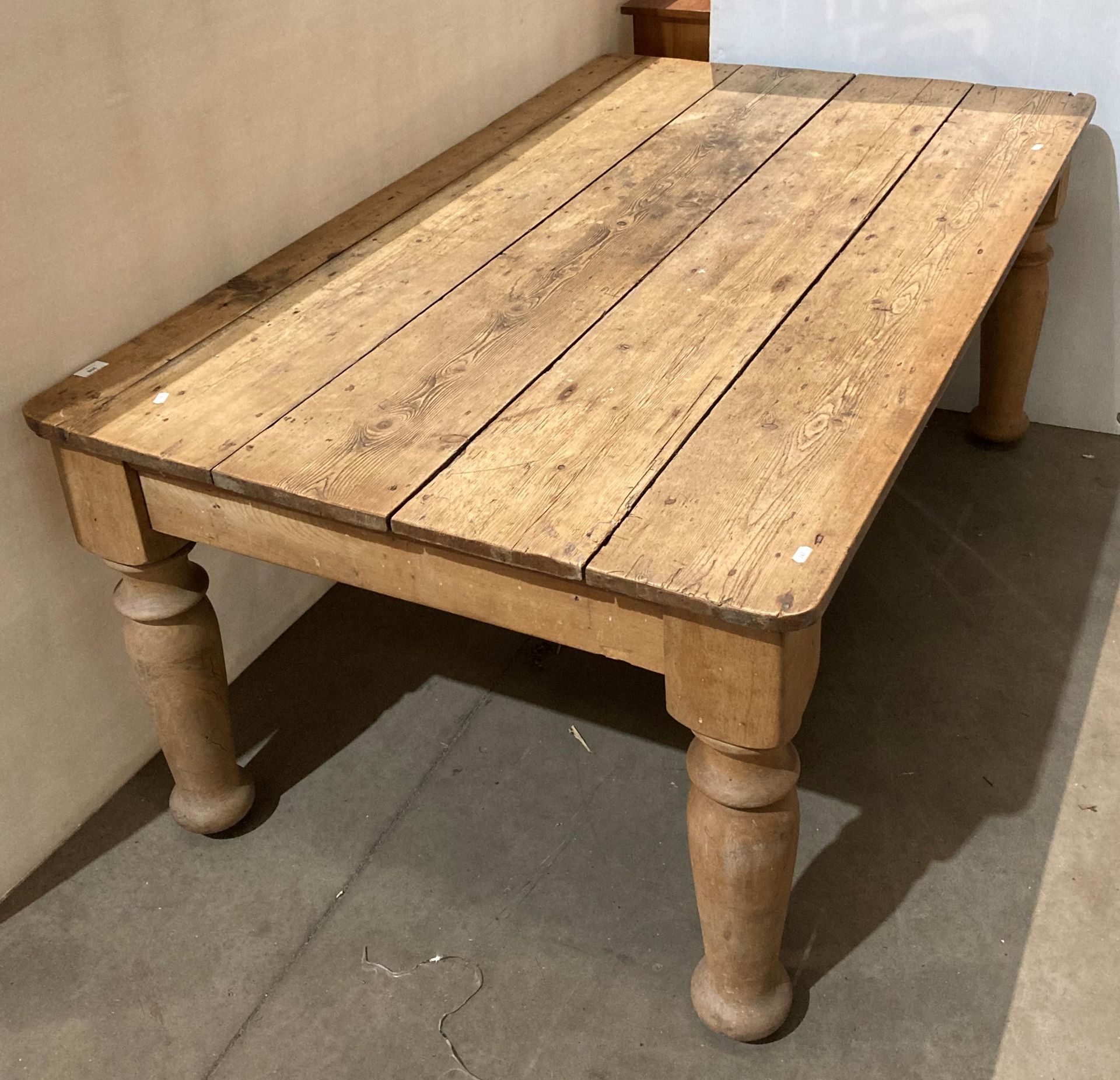 Solid stripped pine farmhouse kitchen table with thick turned legs,