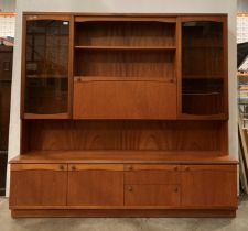 A Mid-Century teak sideboard by William Lawrence with a three-door, two-drawer base section,