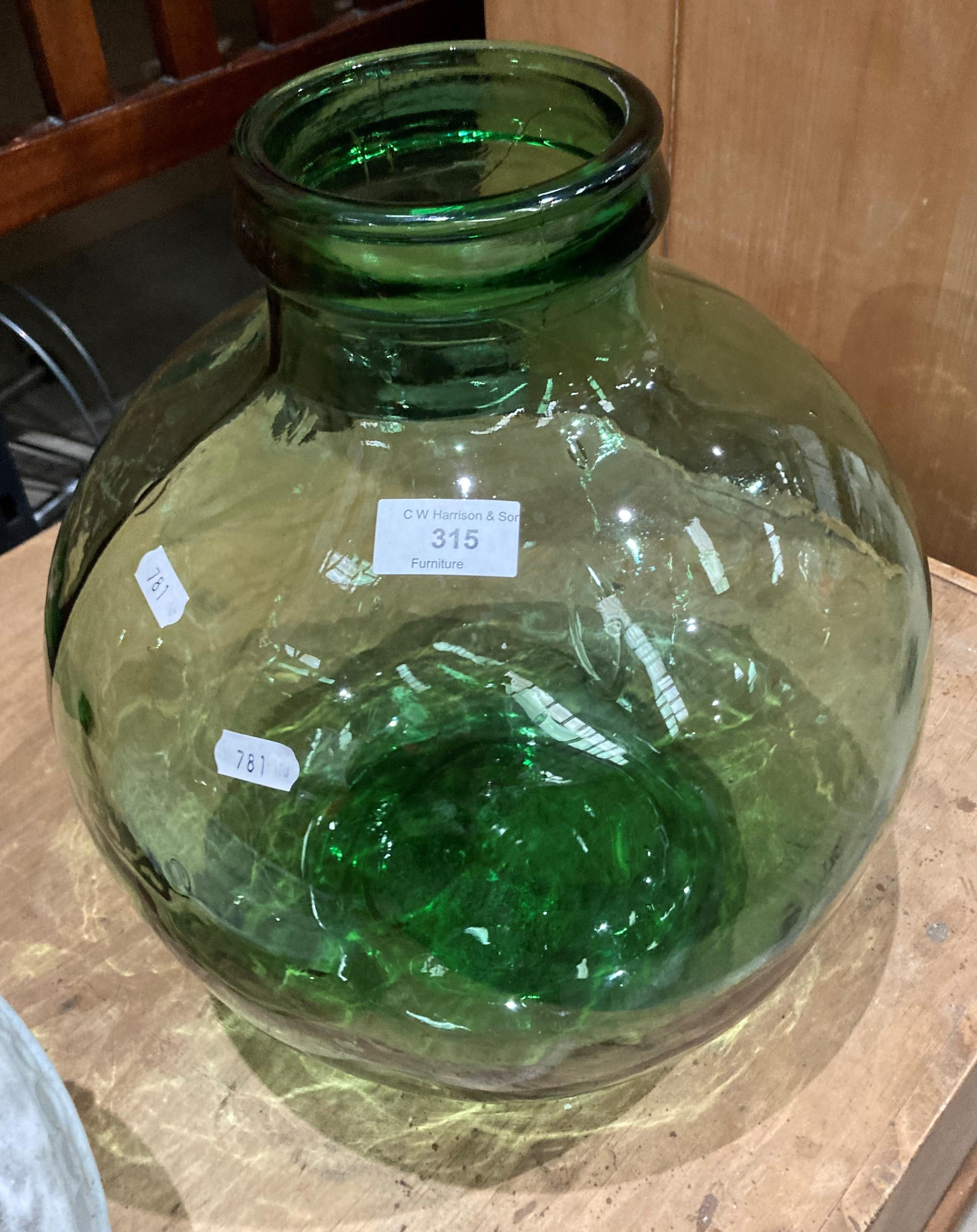 A green glass terrarium,