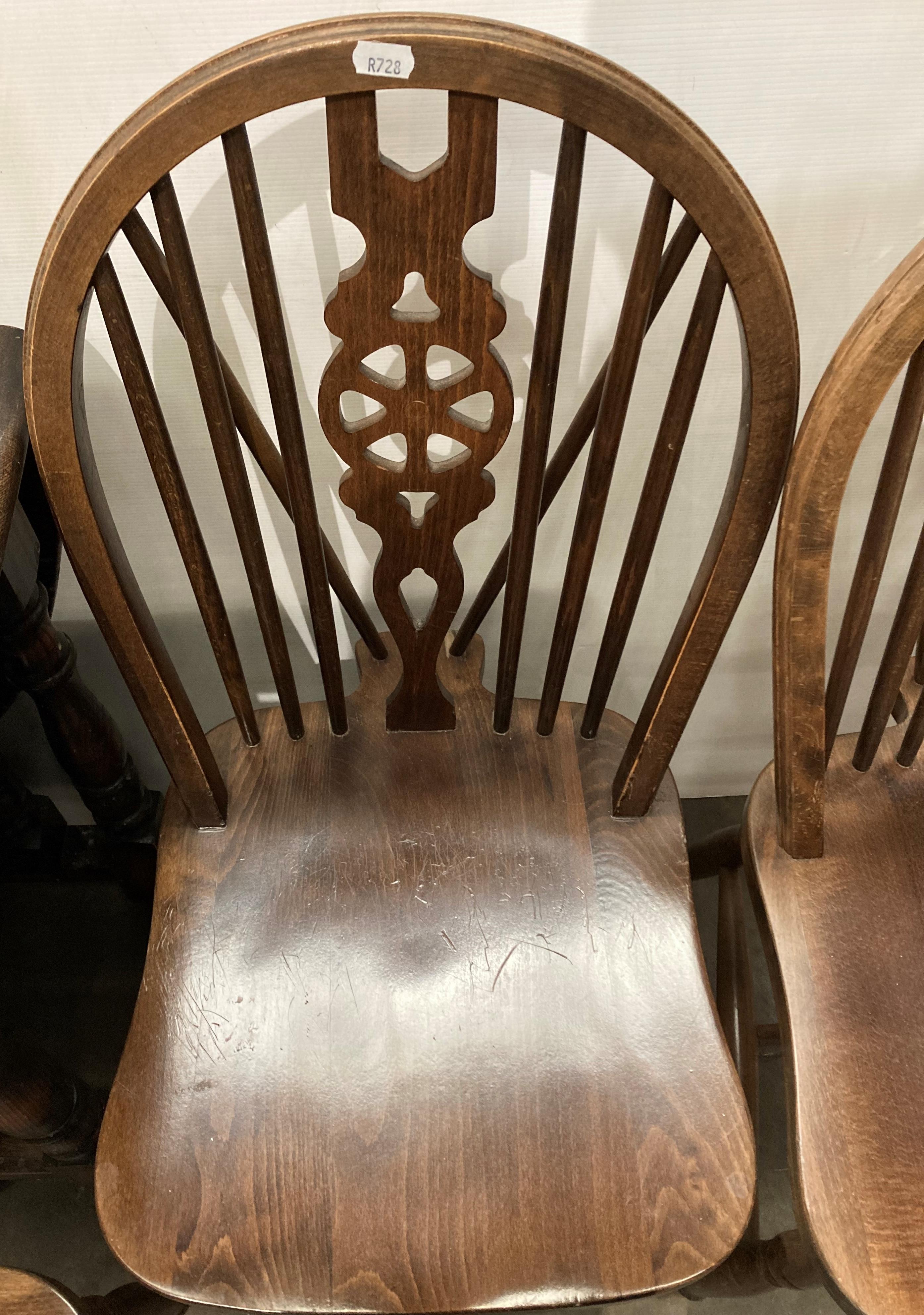 Oak oval drop-leaf gate-leg dining table and four wheel-back dining chairs, - Image 2 of 3