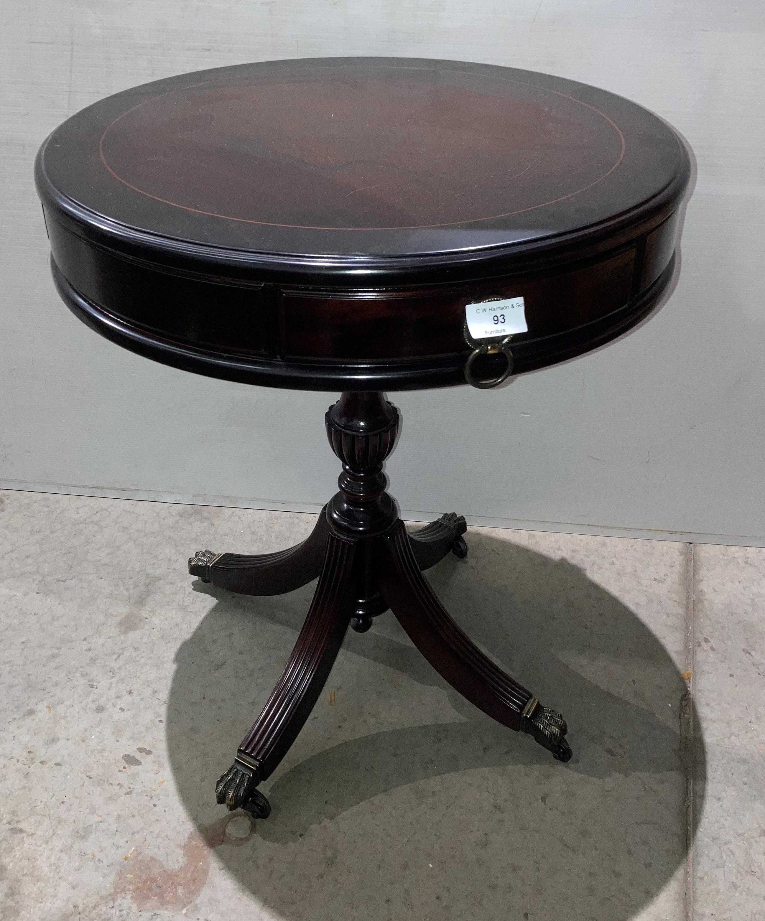 Mahogany finish drum side table with four drawers,