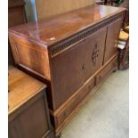 An oak three-door, two-drawer sideboard,