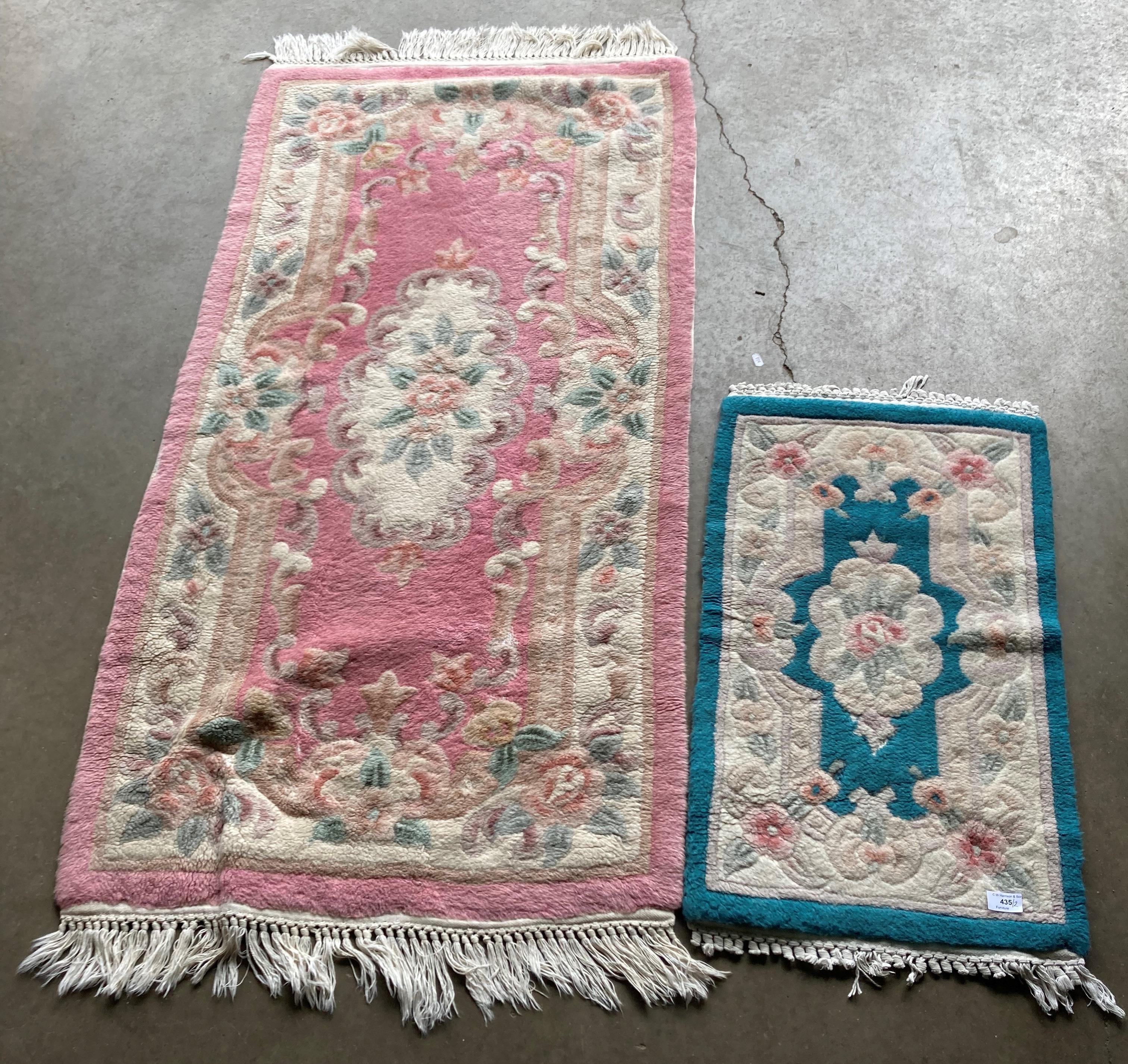 Two Chinese-style rugs - pink pattern (150 x 75cm) and blue pattern (75 x 45cm) (saleroom location: