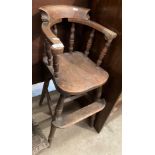 A child's elm high chair (one arm damaged) (saleroom location: MA2)