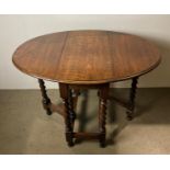 Mid-Century oak drop-leaf oval dining table with barley twist legs,