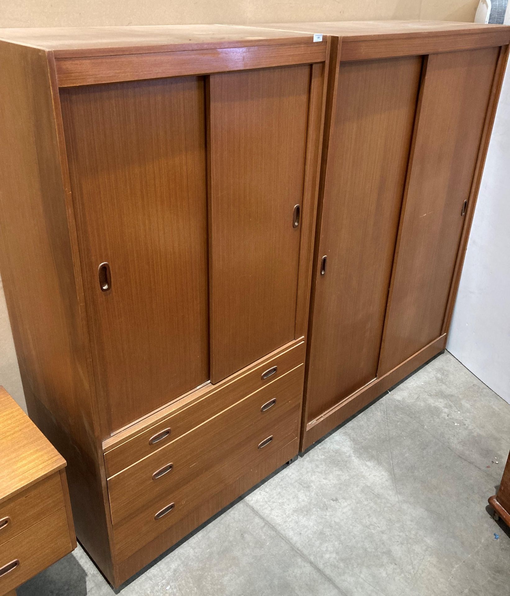 A Mid-Century teak three drawers and two sliding door wardrobe (92 x 177cm high) and matching two