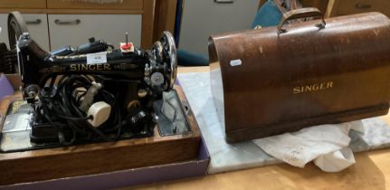 A Singer (240v) sewing machine in portable wooden case (saleroom location: MA4)