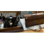 A Singer (240v) sewing machine in portable wooden case (saleroom location: MA4)