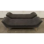 Two velour upholstered bench seat units with brass details on four wooden legs,