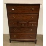 A Stag Minstrel seven drawer chest of drawers with four long and three short,