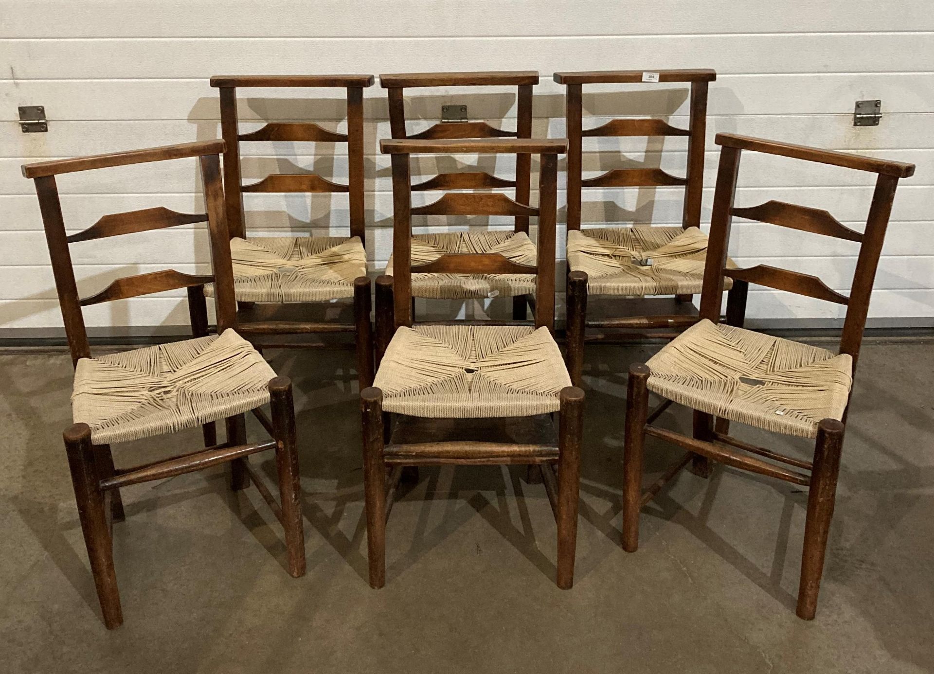 Set of six elm church chairs with re-woven seat and three chairs with book/bible shelves (saleroom