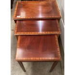 A nest of three mahogany coffee tables (saleroom location: MA2)