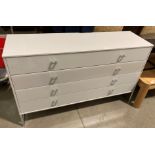 A light grey melamine long chest of drawers with four perspex covered drawers (142 x 43 x 89cm