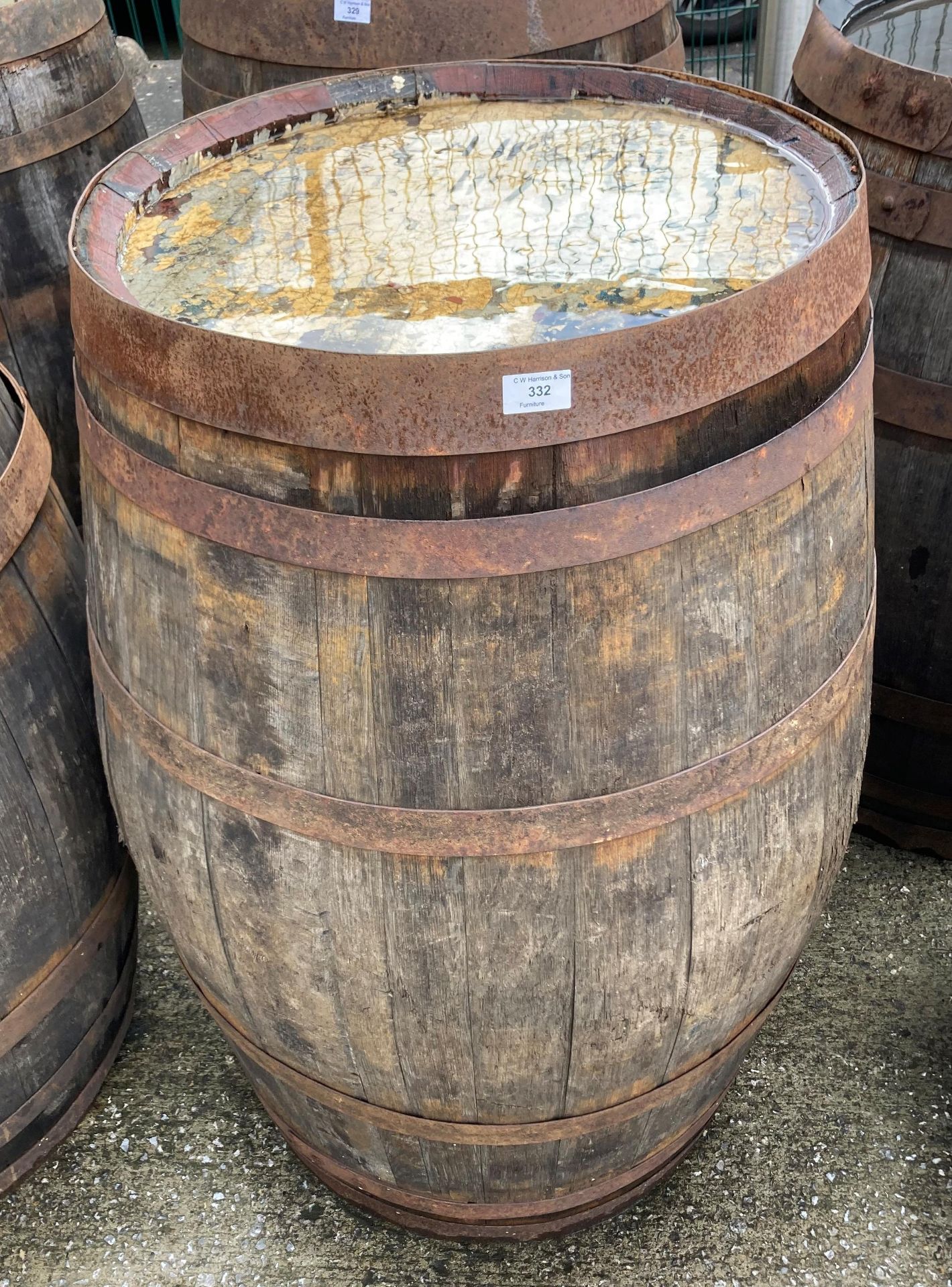 An aged oak whisky/sherry barrel with metal banding,