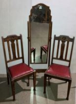 A mahogany cheval mirror (157cm high) and a pair of oak dining chairs with red leather-finish seats