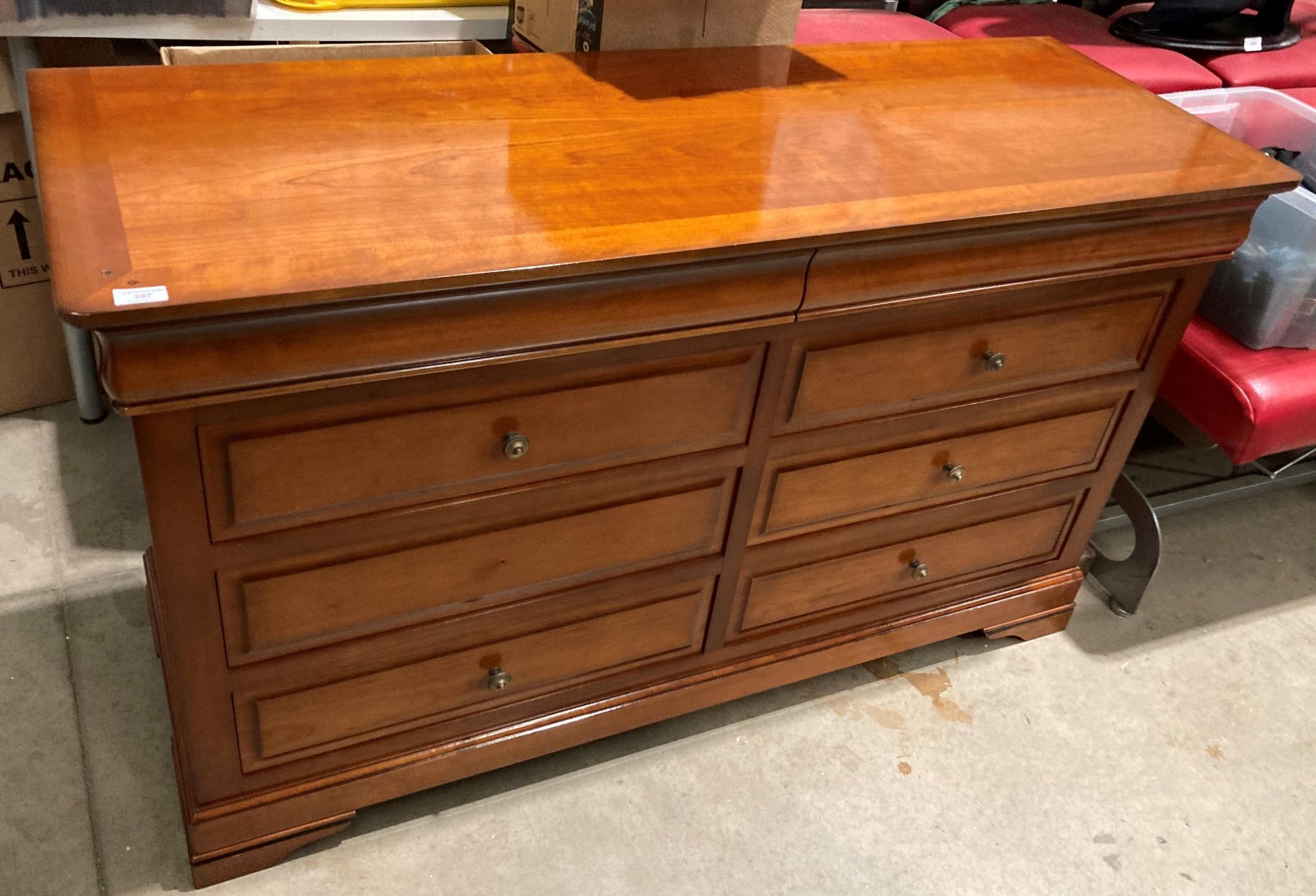 A yew finish eight drawer sideboard (missing knob - in drawer),