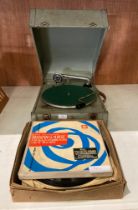 A grey metal 'The Winston' radio gram/record player and records (saleroom location: MA7)