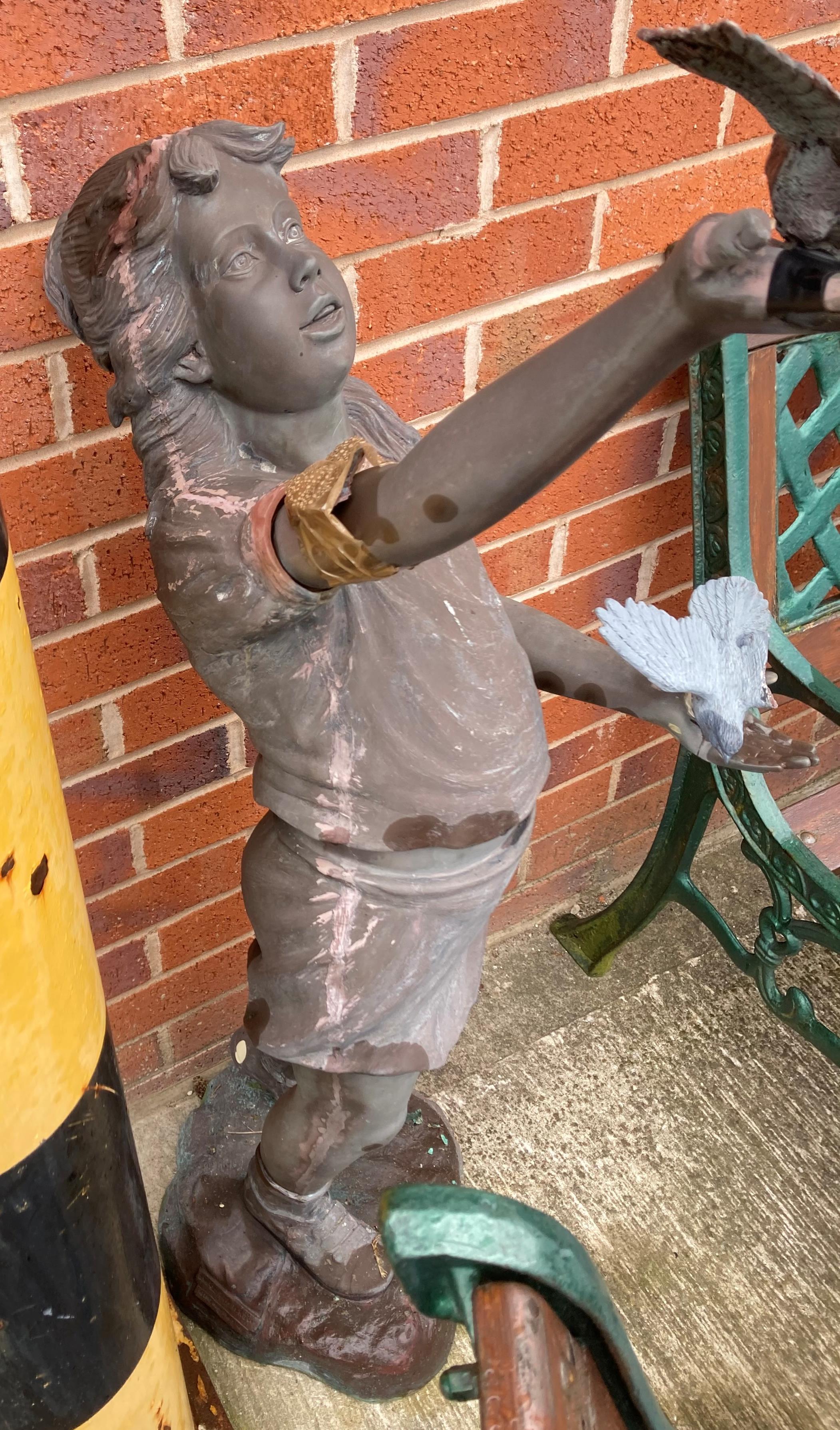 A brown coloured composite statue of a young girl holding birds (120cm high) - sold as seen with - Image 2 of 4