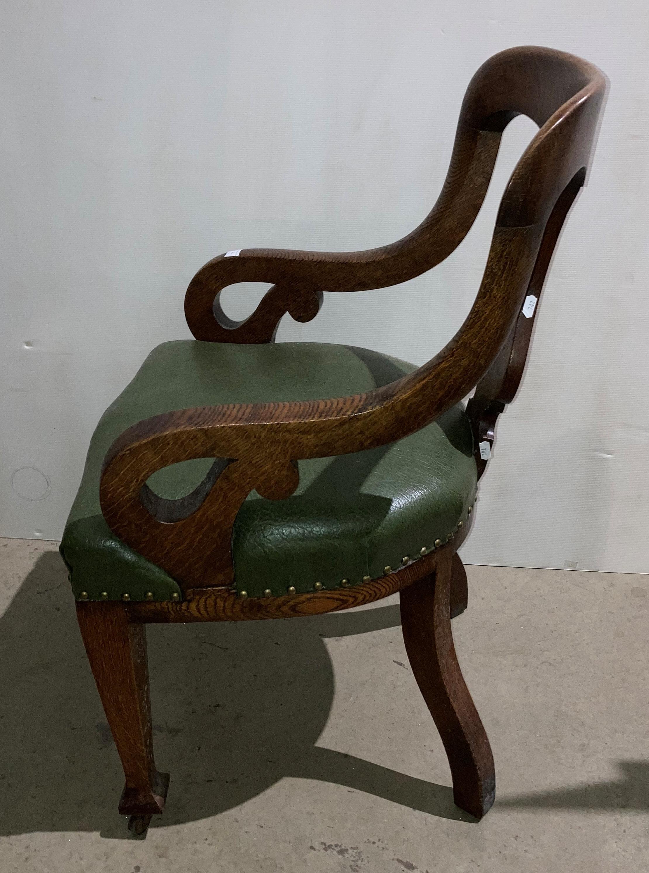 An oak armchair with green leather-finish seat and open scroll arms (saleroom location: S2 QA02) - Image 2 of 4