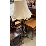 A mahogany standard lamp with ivory coloured shade (saleroom location: MA2)