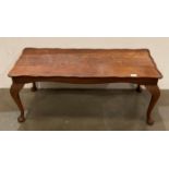 Walnut coffee table on cabriole legs with carved leaf-effect,