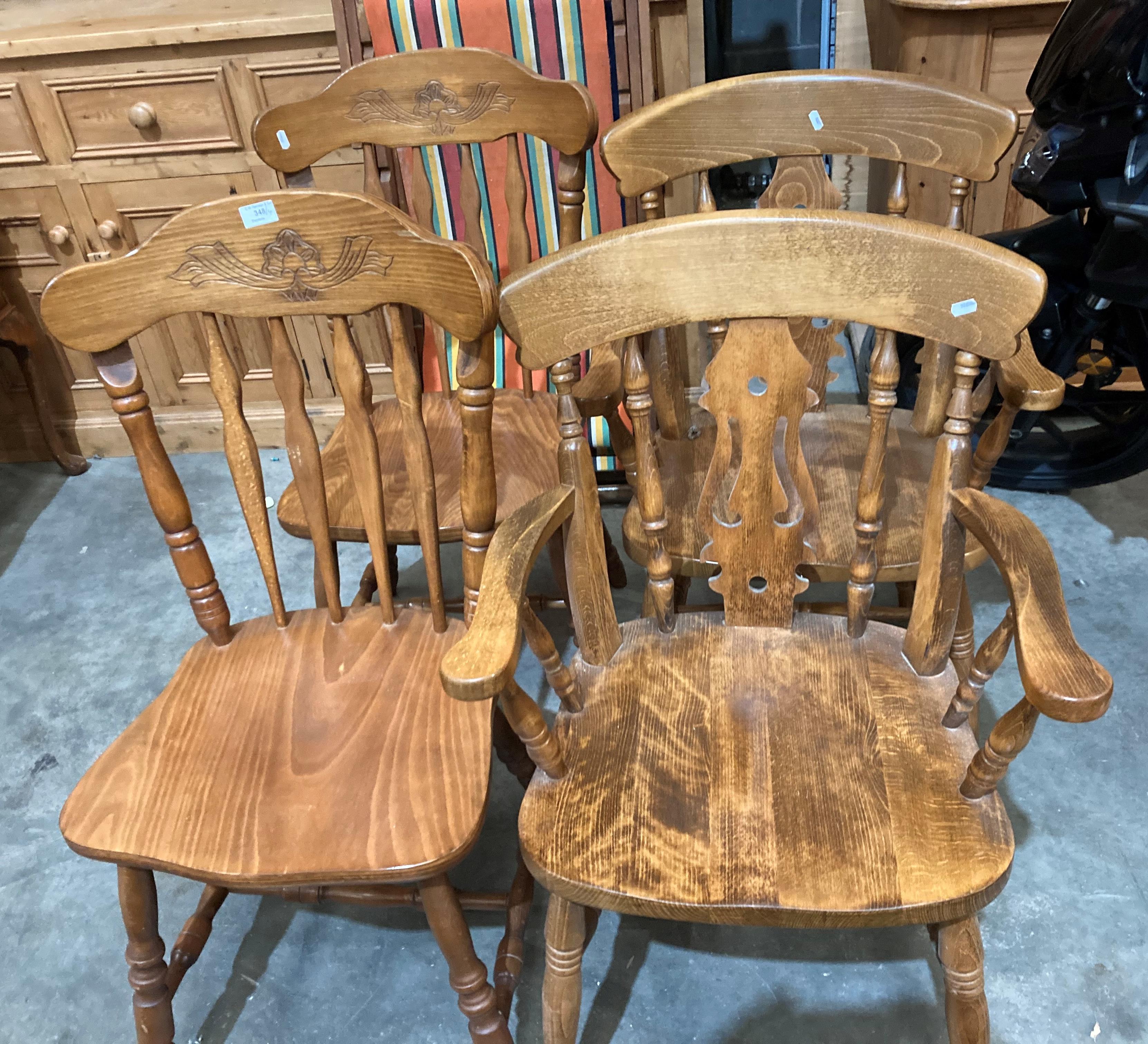 A pair of stained wood dining chairs and a pair of striped wood armchairs (4) (saleroom location: