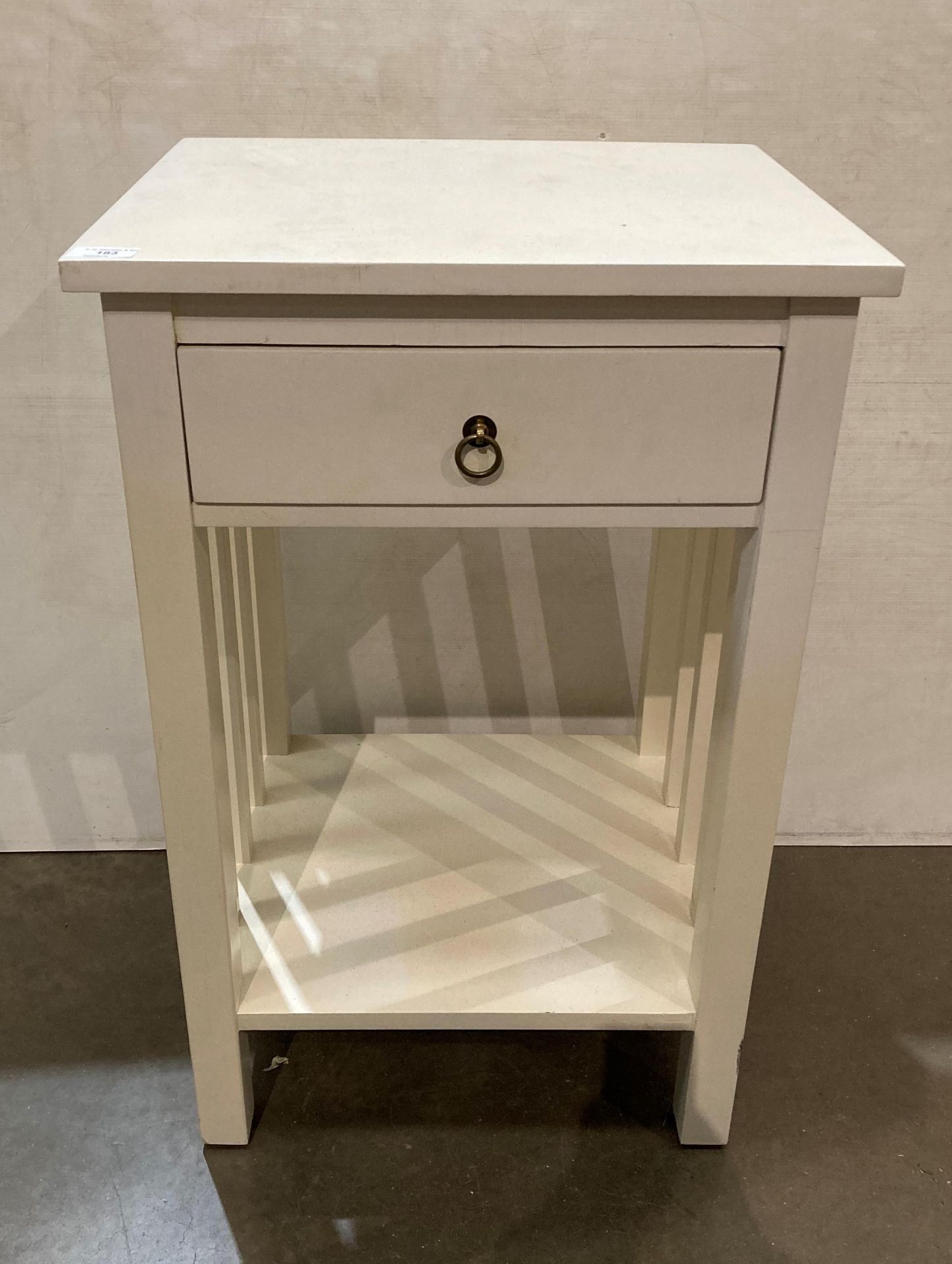 White modern wooden bedside unit with single drawer and under-shelf,