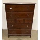 A Stag Minstrel seven drawer chest of drawers with four long and three short,