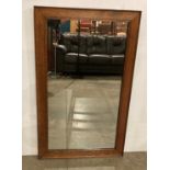 A Mid-Century oak hanging mirror,