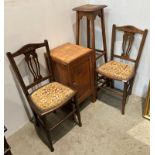 A pair of mahogany bedroom chairs with turned legs and carved back panel,