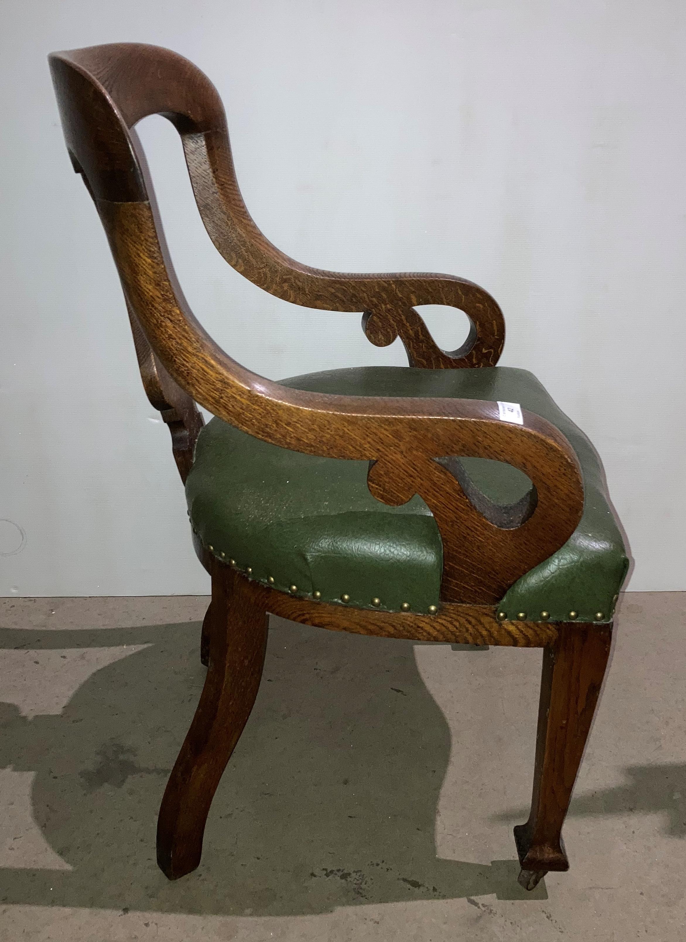 An oak armchair with green leather-finish seat and open scroll arms (saleroom location: S2 QA02) - Image 4 of 4