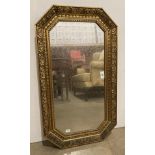 An octagonal gilt framed wall mirror,