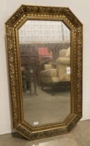 An octagonal gilt framed wall mirror,