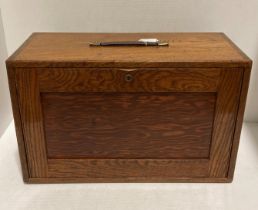An oak engineer's/machinist tool box with five internal long drawers and front cover,