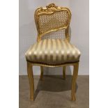 A Victorian-style gilt painted chair with golden striped fabric (saleroom location: MA7)